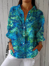 Patricia – Blusa Azul con Estampado Natural